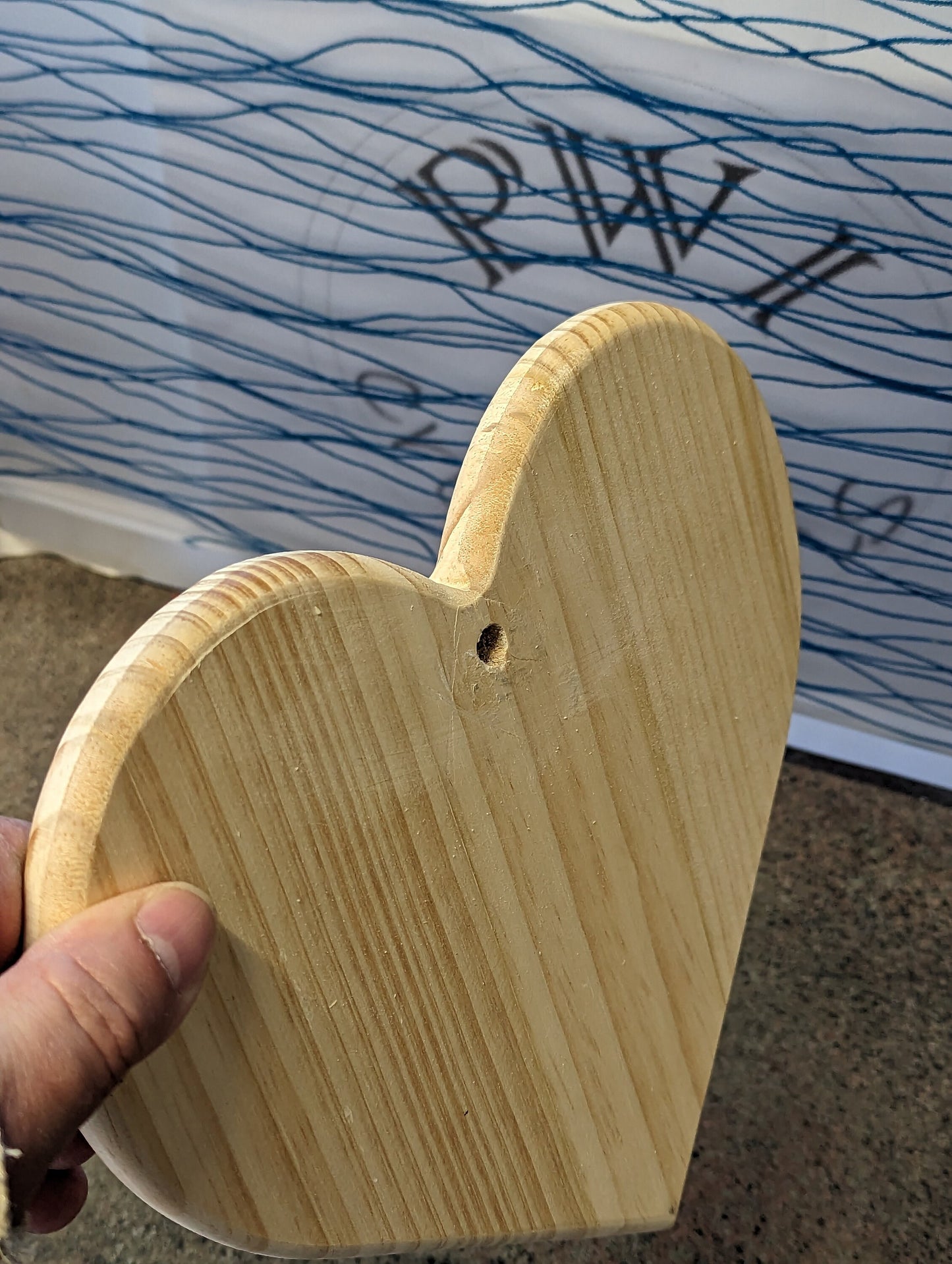 9-inch-wide solid wood heart with romantic couple