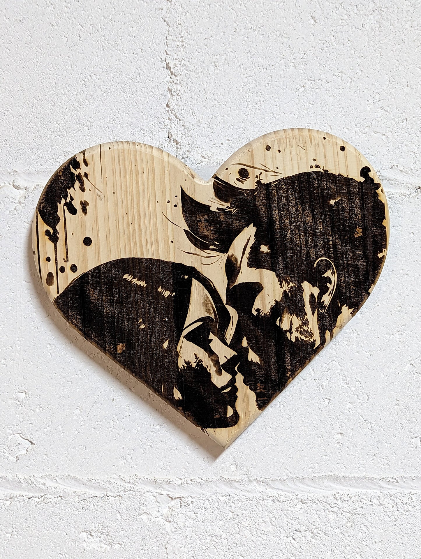 9-inch-wide solid wood heart with romantic couple